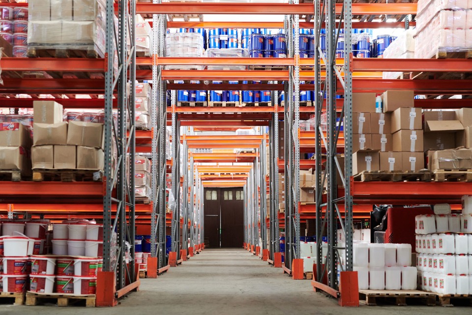 Wide warehouse storage area representing Pendrall product portfolio breadth.